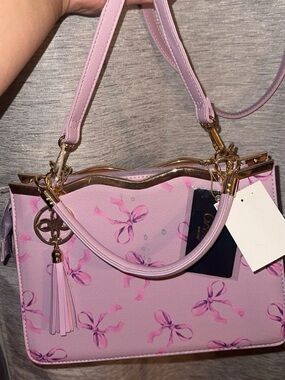 Unlisted Pink Bow Print Satchel with Tassel Charm
